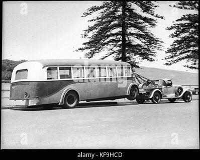 24527 Motor bus being towed to Queensland 1929 Cadillac towtruck Stock Photo