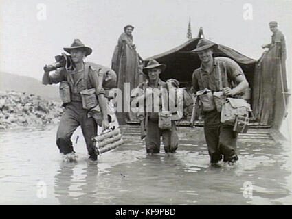 A historical photograph of Australian Army soldiers marching along ...