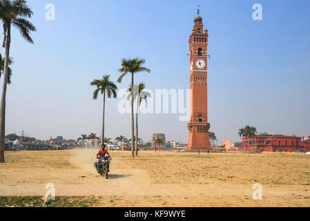 INDIA, LUCKNOW : Motorcycle passing colonial clocktower in Lucknow, Uttar Pradesh Stock Photo