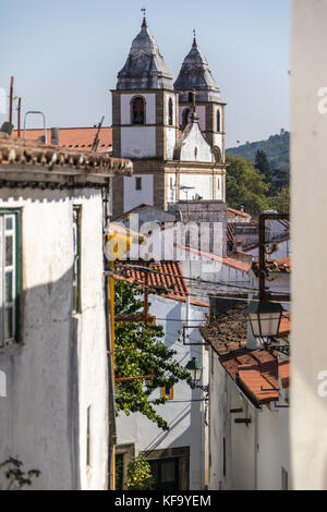 Narrow alley and  Santa Maria da Devesa church, Castelo de Vide, Portugal Stock Photo