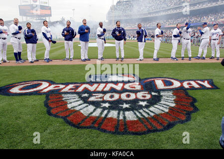 The Los Angeles Dodgers look skyward as a stealth bomber flies overhead during opening day ceremonies before a game with the Atlanta Braves in Los Angeles on Monday, April 3, 2006. Photo by Francis Specker Stock Photo