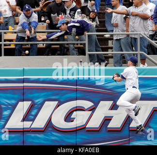 Los Angeles Dodgers right fielder J.D. Drew, right, watches a ball hit by Atlanta Braves' Adam LaRoche go into the stands for a three-run home run off Dodgers pitcher Derek Lowe in the first inning of a baseball game in Los Angeles on Monday, April 3, 2006. Photo by Francis Specker Stock Photo