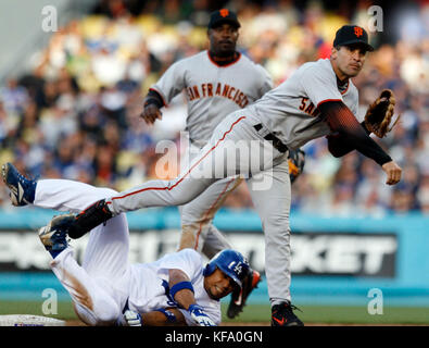 San Francisco Giants shortstop Omar Vizquel (left) is late on the tag as  Los Angeles Dodgers pitcher Greg Maddux's stolen second base in the fourth  inning. The Dodgers defeated the Giants 4-2