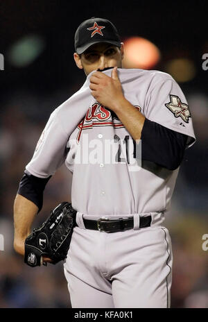 Houston Astros pitcher Andy Pettitte wipes his face with his jersey after giving up a three-run homer to Los Angeles Dodgers' Nomar Garciaparra in the third inning of a baseball game in Los Angeles on Tuesday, May 9, 2006. Photo by Francis Specker Stock Photo