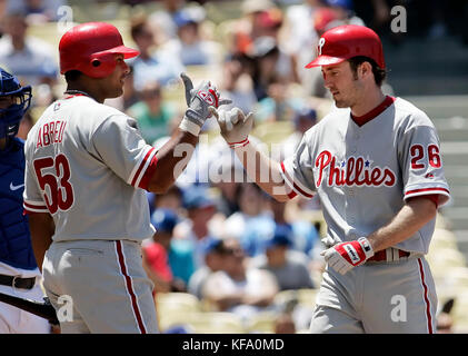The Phillies' Bobby Abreu (53) is held to first base by a Sunny