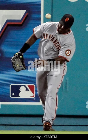 San Francisco Giants left fielder Barry Bonds tries to field a double hit off the wall by  Los Angeles Dodgers' Russell Martin during the sixth inning of a baseball game in Los Angeles on Friday, July 7, 2006. Photo by Francis Specker Stock Photo