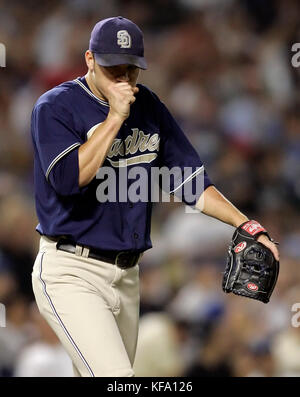 Former San Diego Padres pitcher Jake Peavy, left, reacts as he is