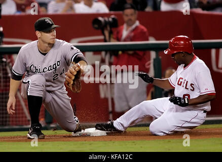 Los Angeles Angels' Chone Figgins, right, slides safely into third base on a triple as Chicago White Sox third baseman Joe Crede waits for the throw in the sixth inning of a baseball game in Anaheim, Calif., on Monday, Sept. 11, 2006. Photo by Francis Specker Stock Photo