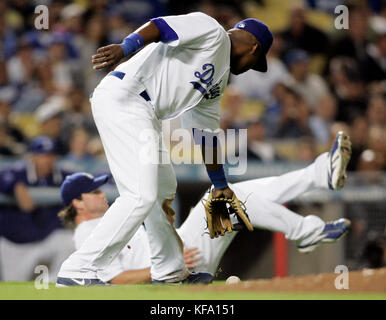 Los Angeles Dodgers third baseman Wilson Betemit, foreground, and pitcher Derek Lowe try to field an infield hit by San Francisco Giants' Rich Aurilia in the fifth inning of a baseball game in Los Angeles, on Tuesday, April 24, 2007. Photo by Francis Specker Stock Photo