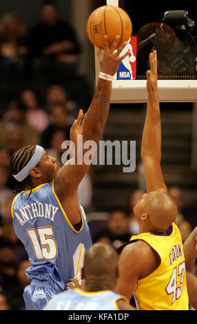 Denver Nuggets Carmelo Anthony shoots over Phoenix Suns Quentin ...