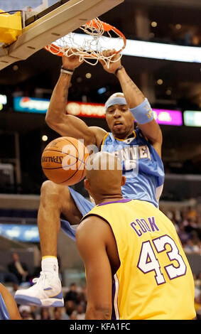 Denver Nuggets' Kenyon Martin dunks over Memphis Grizzlies' Pau Gasol ...