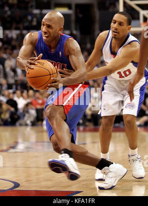 Detroit Pistons' Chauncey Billups, left, is fouled by Los Angeles Clippers' Howard Eisley as he drives past hiim in the first half in Los Angeles on Sunday, Dec. 11, 2005. The Pistons won, 109-101.  Photo by Francis Specker Stock Photo