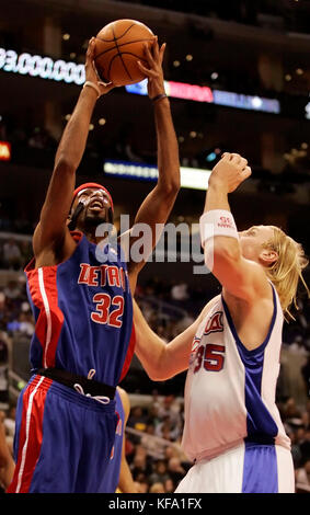 Detroit Pistons' Richard Hamilton, left, shoots over Los Angeles Clippers' Chris Kaman in the first half in Los Angeles on Sunday, Dec. 11, 2005. Photo by Francis Specker Stock Photo