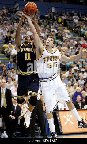 Michigan's John Andrews, left, and UCLA's Matt McKinney battle for a rebound during the  first half  in Los Angeles on Saturday, Dec. 18, 2004.  Photo by Francis Specker Stock Photo