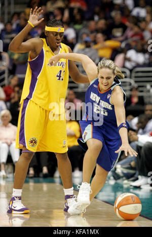 New York Liberty's Becky Hammon, right, tries to stay inbounds while dribbling around Los Angeles Sparks' Nikki Teasley in the second half in  Los Angeles on Tuesday, July 5, 2005. The Liberty won, 67-55.  Photo by Francis Specker Stock Photo