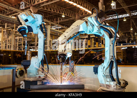 Robots are welding in car factory Stock Photo