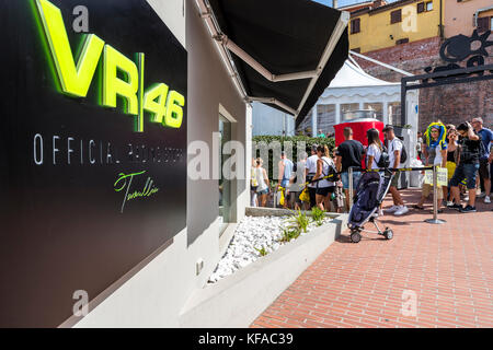 Fans queue at the VR46 merchandise and fan shop. Tavullia, Italy. Hometown of Valentino Rossi. Stock Photo