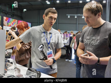 KIEV, UKRAINE - OCTOBER 07, 2017: People testing professional photographic cameras on Sony company booth during CEE 2017, the largest electronics trad Stock Photo
