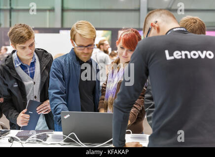 KIEV, UKRAINE - OCTOBER 07, 2017: Unrecognized people visit Lenovo, a Chinese multinational technology company booth during CEE 2017, the largest elec Stock Photo