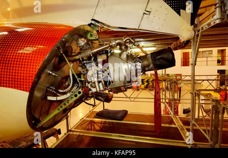 a view of the rear exhaust of the British Airways - CitiExpress Embraer ERJ-145 during maintenance in the hangar Stock Photo