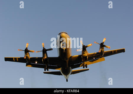 a US Navy Lockheed P-3C Orion on final-approach with black smoking-engines Stock Photo