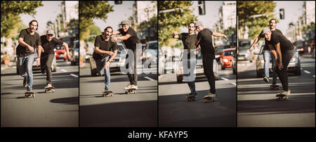 Two friends skateboarders riding skate sequence. Free ride skateboarding. Traffic skate style Stock Photo