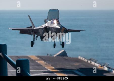 A U.S. Marine Corps F-35B Lightning II stealth fighter aircraft lands on the flight deck aboard the U.S. Navy Wasp-class amphibious assault ship USS Essex during Exercise Dawn Blitz October 22, 2017 in the Pacific Ocean.   (photo by Roderick Jacquote via Planetpix) Stock Photo