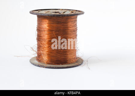Copper wire on spool, isolated on white backgrounds, with clipping paths on white background Stock Photo
