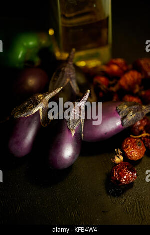 Eggplant, dried rosehip and olive oil.A pleasant lunch and harvest festival. Stock Photo