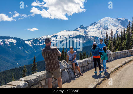 Tourists at the Sunrise area of Mount Rainier National Park at an elevation of 6,400 feet is the highest point that can be reached by vehicle at Mount Stock Photo