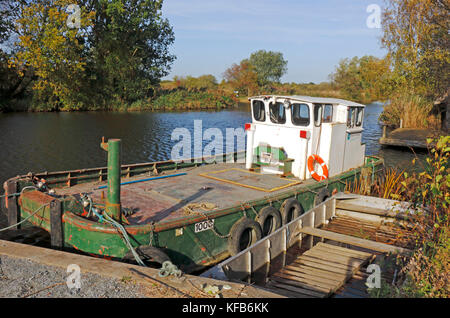 A Broads Authority maintenance boat moored on the Norfolk Broads by How Hill, Ludham, Norfolk, England, United Kingdom. Stock Photo