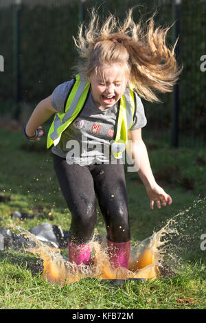 The World Puddle Jumping Championships at Wicksteed Park in Northamptonshire on Wednesday October 25th.  Youngsters have been making a splash at the World Puddle Jumping Championships at Wicksteed Park in Northamptonshire today (Wed).  Competitors battled it out to make the biggest splash at the fifth annual contest in Kettering.  Organisers created a special series of championship-standard puddles and judges gave scores based on things such as height of jump, enthusiasm, distance of splash and stickability (the amount of mud which clings to each competitor). Stock Photo