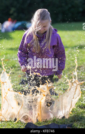 The World Puddle Jumping Championships at Wicksteed Park in Northamptonshire on Wednesday October 25th.  Youngsters have been making a splash at the World Puddle Jumping Championships at Wicksteed Park in Northamptonshire today (Wed).  Competitors battled it out to make the biggest splash at the fifth annual contest in Kettering.  Organisers created a special series of championship-standard puddles and judges gave scores based on things such as height of jump, enthusiasm, distance of splash and stickability (the amount of mud which clings to each competitor). Stock Photo