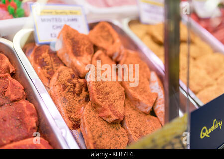 Tray of finest minted lamb chops on a butchers tray on a butchers market stall in Yorkshire, England in the United Kingdom Stock Photo