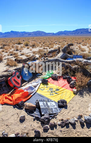 remains of the famous Joshua tree used as a photo location for the U2 album of the same name. fans have turned into a shrine just off hwy 190 California Stock Photo