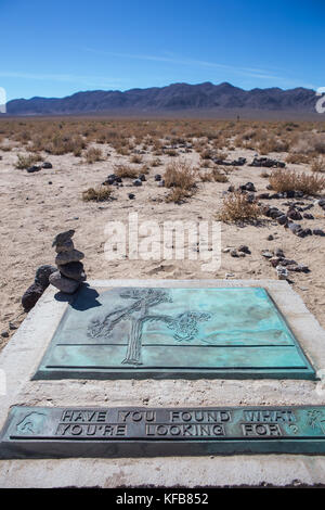 remains of the famous Joshua tree used as a photo location for the U2 album of the same name. fans have turned into a shrine just off hwy 190 California Stock Photo