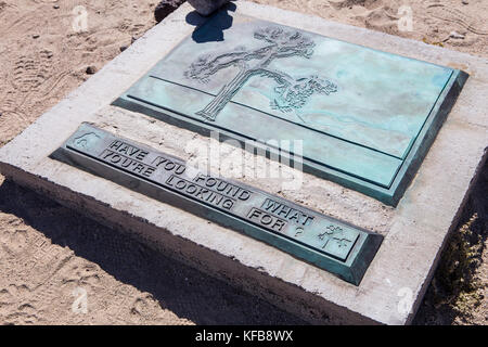 remains of the famous Joshua tree used as a photo location for the U2 album of the same name. fans have turned into a shrine just off hwy 190 California Stock Photo