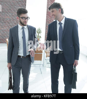 Two company employees discuss business issues Stock Photo