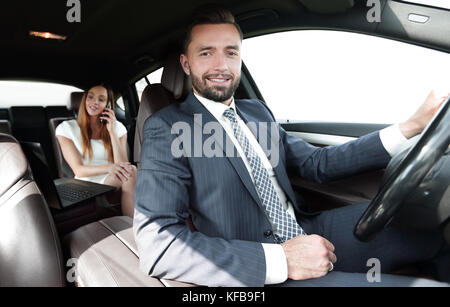 Attractive elegant serious man drives good car Stock Photo