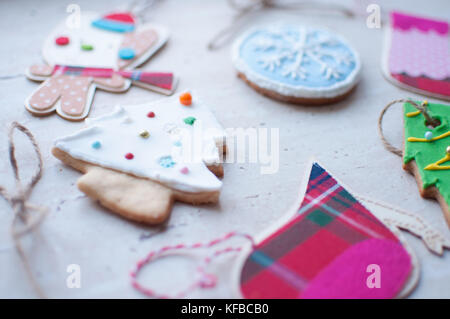 Diversity of Christmas toys - the flat wooden and textile toys and the gingerbread cookies in the different shapes. Stock Photo