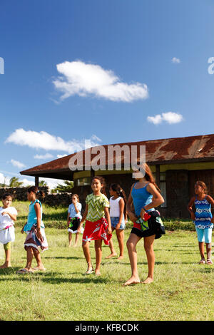 EASTER ISLAND, CHILE, Isla de Pascua, Rapa Nui, children playing and learning traditional dances on the lawn Stock Photo