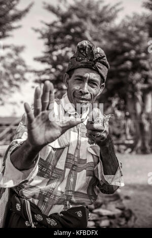 INDONESIA, Flores, a man demonstrates one of his traditional boxing poses in his village Kampung Tutubhada in Rendu Stock Photo