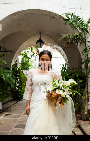 PHILIPPINES, Manila, portrait of Ana Ma-An, a bride before her wedding in the Intramros District Stock Photo