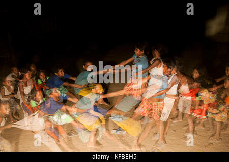 PHILIPPINES, Palawan, Barangay region, children play tug-of-war without a rope in Kalakwasan Village Stock Photo