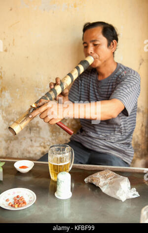 Man smoking pipe in Hanoi, Vietnam Stock Photo - Alamy