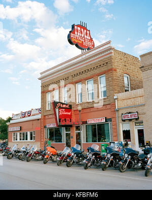 USA, Wyoming, motorcycles in a row parked outside Irma Restaurant and Hotel, Cody Stock Photo