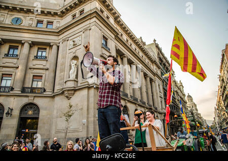 October 27, 2017 - Barcelona, Catalonia, Spain - A pro independence farmer seen using his loud speaker to celebrate. Farmers Union tractor passes in front of the headquarters of the Spanish national police to join the party that takes place in PlaÃ§a de Sant Jaume.Few hours after the President Carles Puigdemont announced the independence of Catalonia, several tractors of the Union of farmers have joined the party to celebrate the Declaration of the new Catalan Republic.  Meanwhile , a large crowd of people have taken the plaza Sant Jaume in Barcelona, headquarters of the Generalitat de Catalun Stock Photo