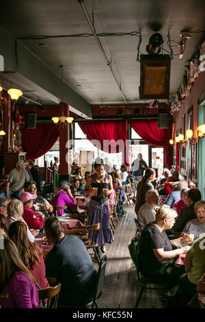 USA, Alaska, Sitka, guests take a break from walking around the streets of downtown Sitka to eat lunch at the Red Onion Saloon Stock Photo