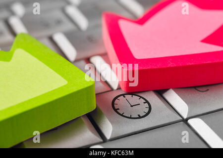 Time alert warning symbol on a keyboard laptop. Pressure work Stock Photo