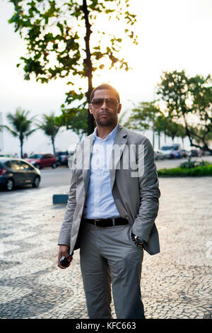 BRAZIL, Rio de Janiero, a man stands outside of Hotel Fasano, located near Ipanema Beach Stock Photo